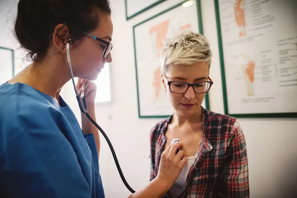 A nurse treating a patient
